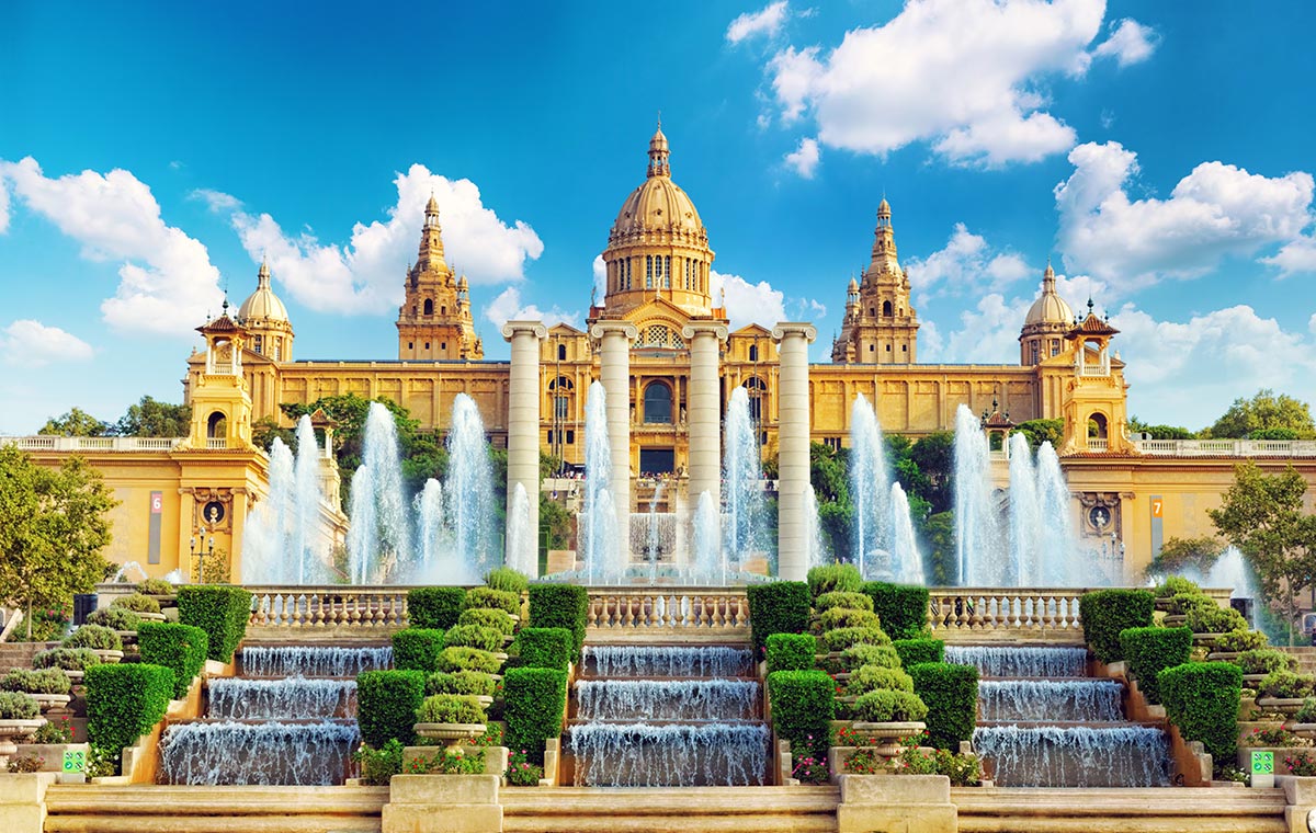 Settle back in business class seats to Barcelona to enjoy the thrill of Montjuic. - IFlyFirstClass