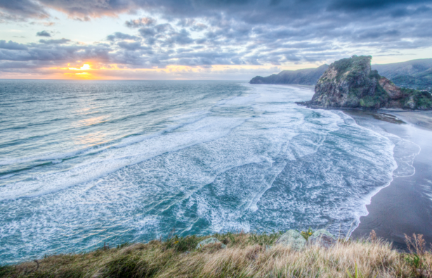 Piha Beach is a surfer's paradise and a fun place to relish first class beach activities. - IFlyFirstClass